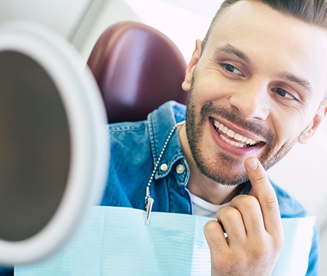 Patient smiling while visiting a Vienna emergency dentist