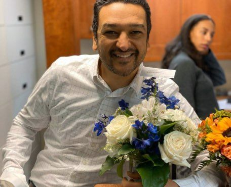 Vienna dentist Doctor Saad holding flowers