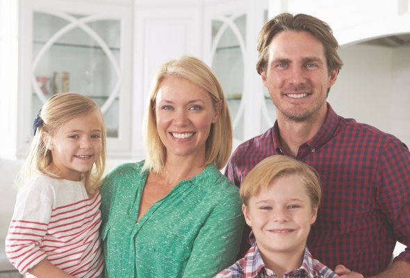 Smiling family of four