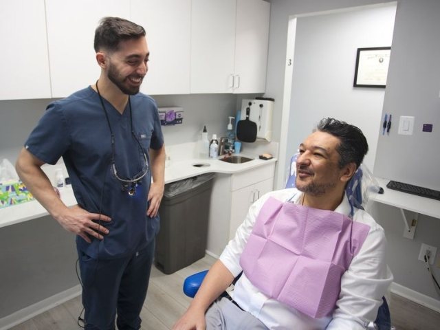 Vienna dentist and dental team members smiling outdoors
