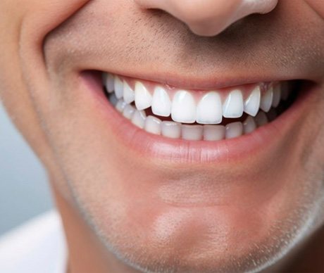 Close-up of man’s smile with healthy pink gums