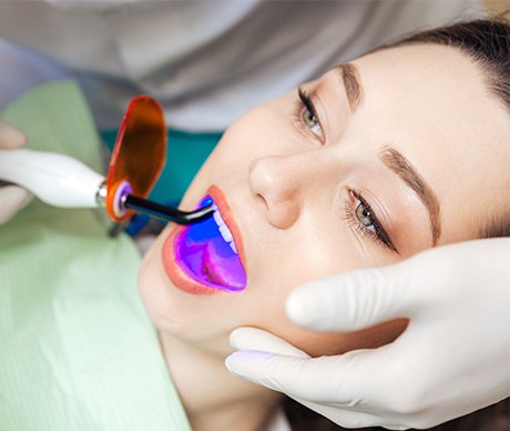 Woman receiving dental sealants