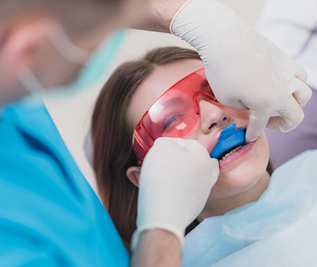 Young person receiving fluoride treatment