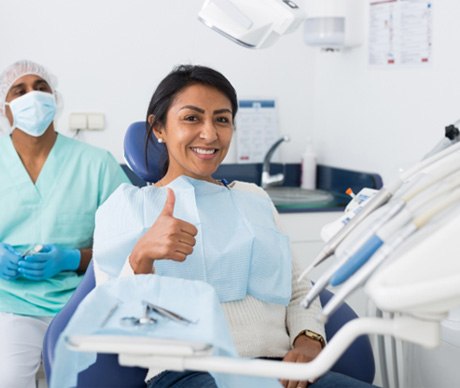 Woman giving thumbs up for dental sedation in Vienna   