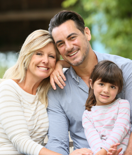 Smiling family outdoors