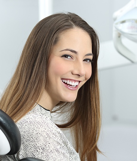 Woman in dental chair smiling