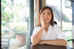 woman at a restaurant with a lost dental filling