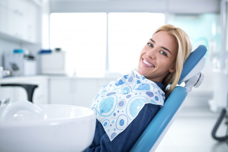 smiling patient after oral cancer screening