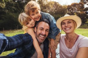 family of four outdoors after spring cleaning in Vienna, VA 