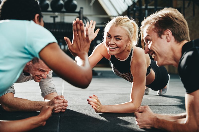 a group of young people working out together