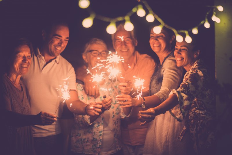 Smiling people celebrating New Year’s Eve