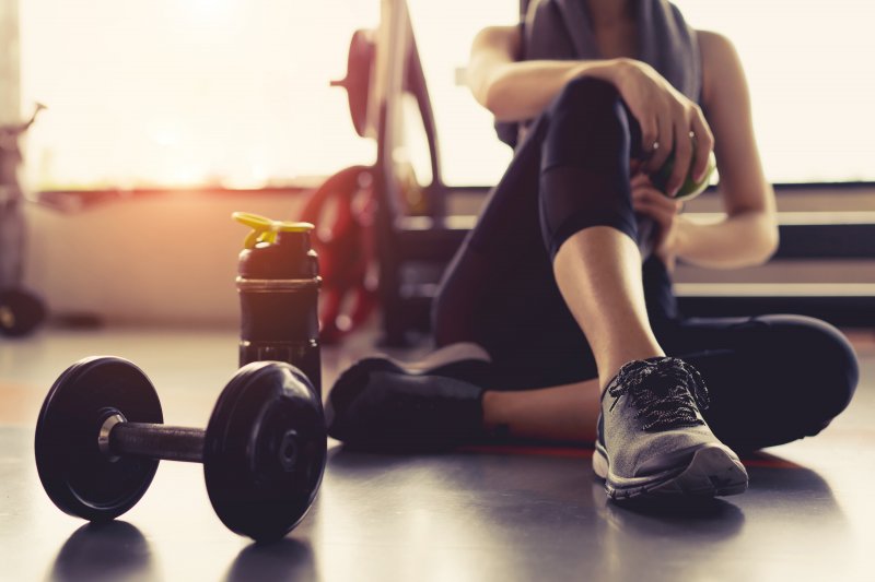 A woman working out to help prevent gum disease