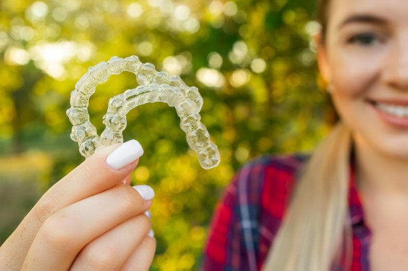 Teen shows her Invisalign clear aligners